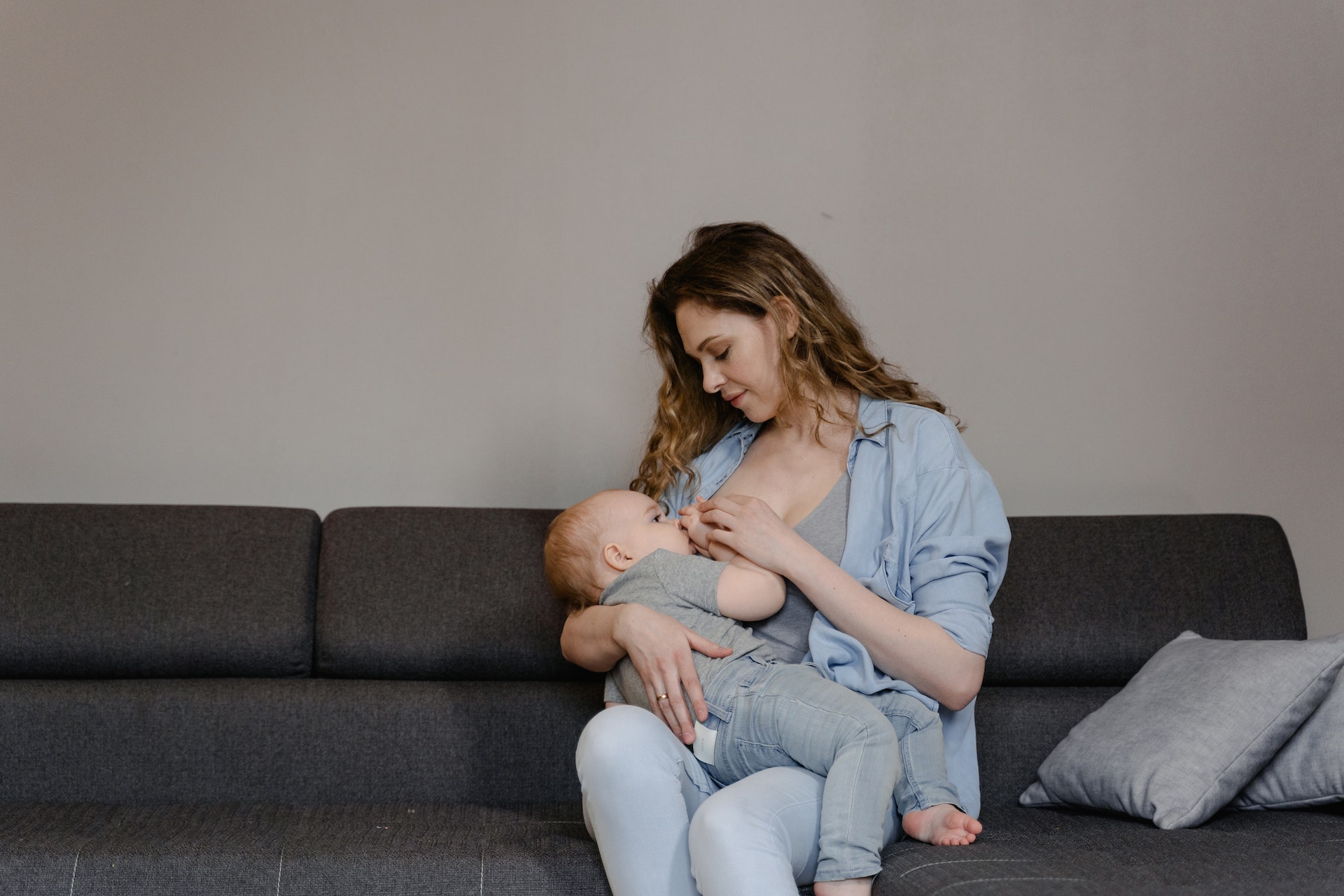 A mother breastfeeding with her child
